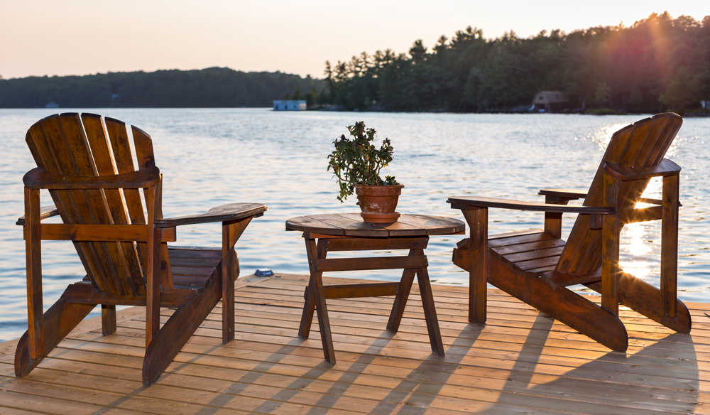 chairs on deck overlooking lake