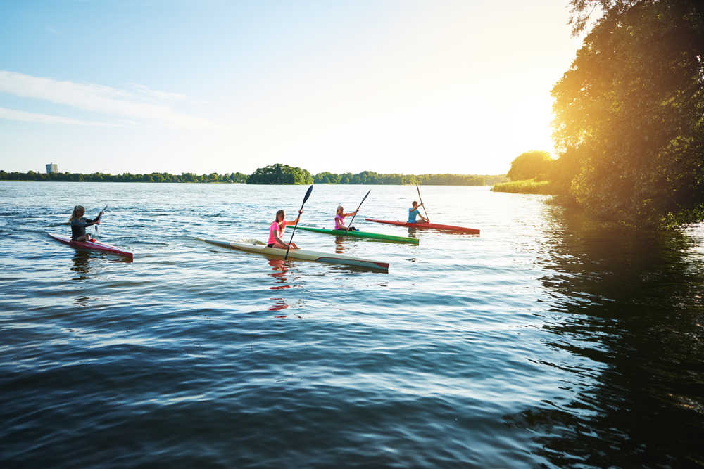 people kayaking on lake