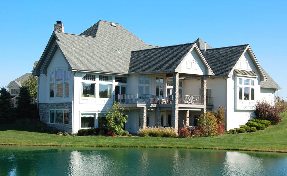 house in front of a lake