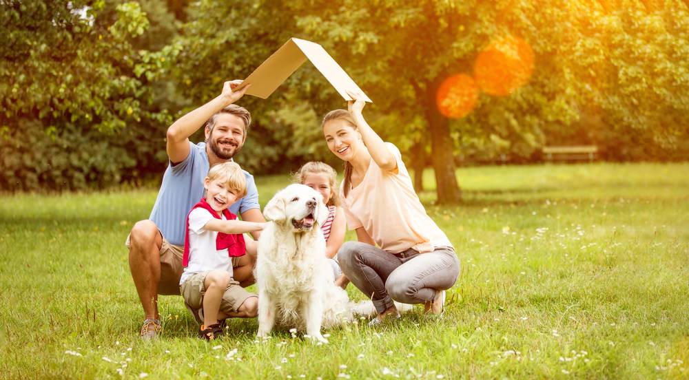 family and dog planning a new home