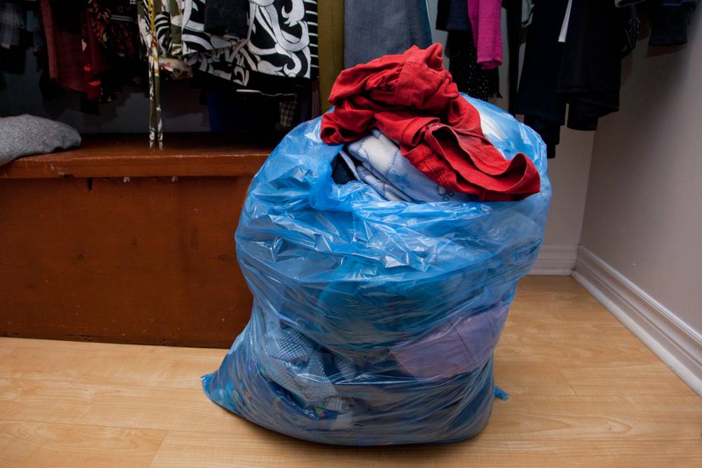 trash bag filled with clothes
