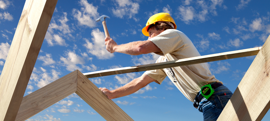 man building a house