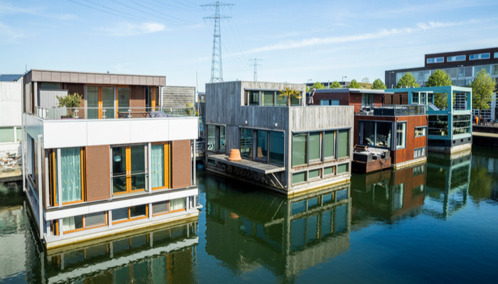 Row of modern floating design houses or boathouses