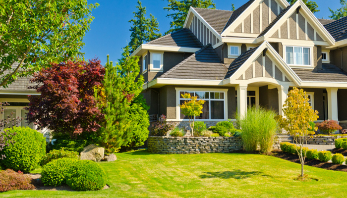 Nice house with gorgeous outdoor landscape on a sunny day