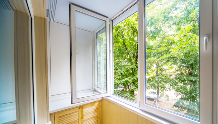 Open modern style window with a view of the forest