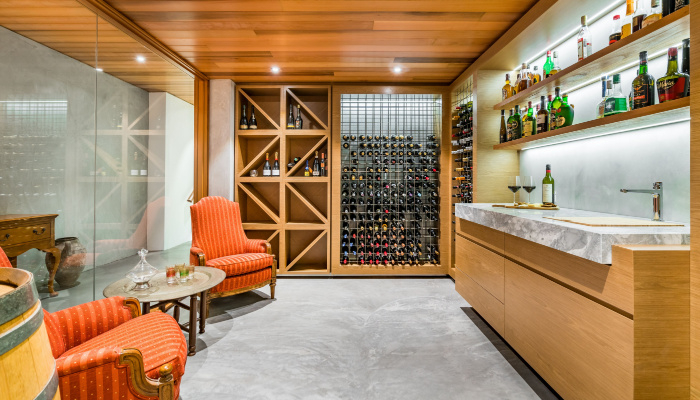 Modern design wine cellar with timber ceiling and contemporary furniture