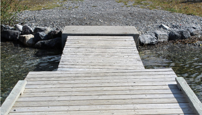 An uneven dock looking towards the shore