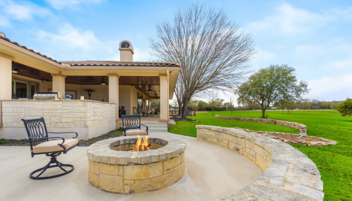 Beautiful patio with fire pit in a beautiful home